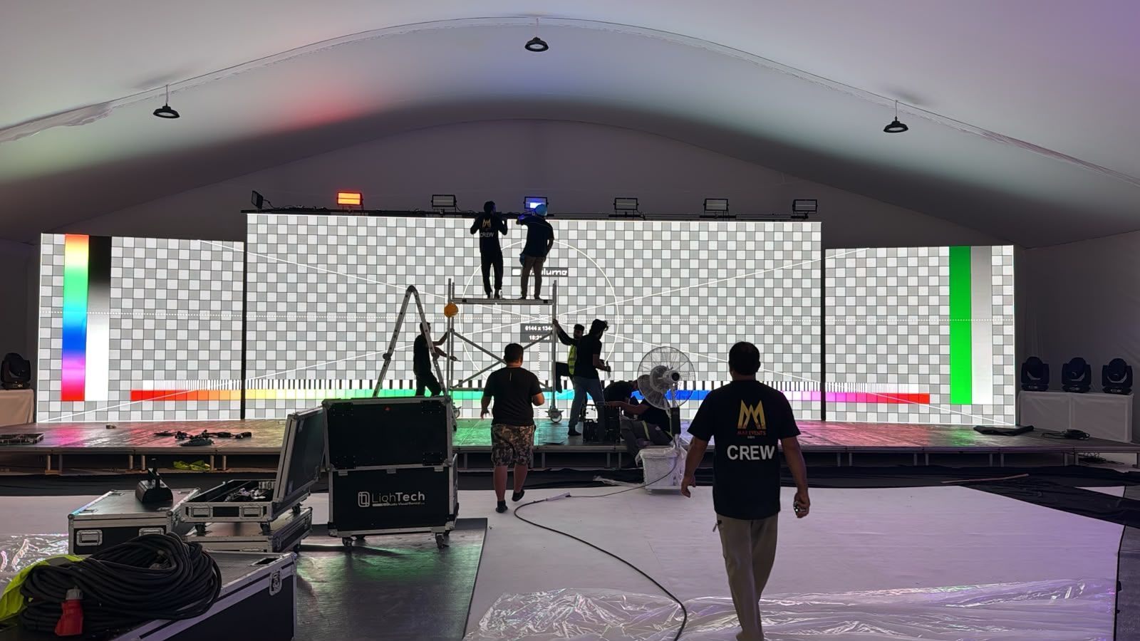 Panoramic three-section LED screen calibration with test pattern before the Weston groundbreaking ceremony in Dubai