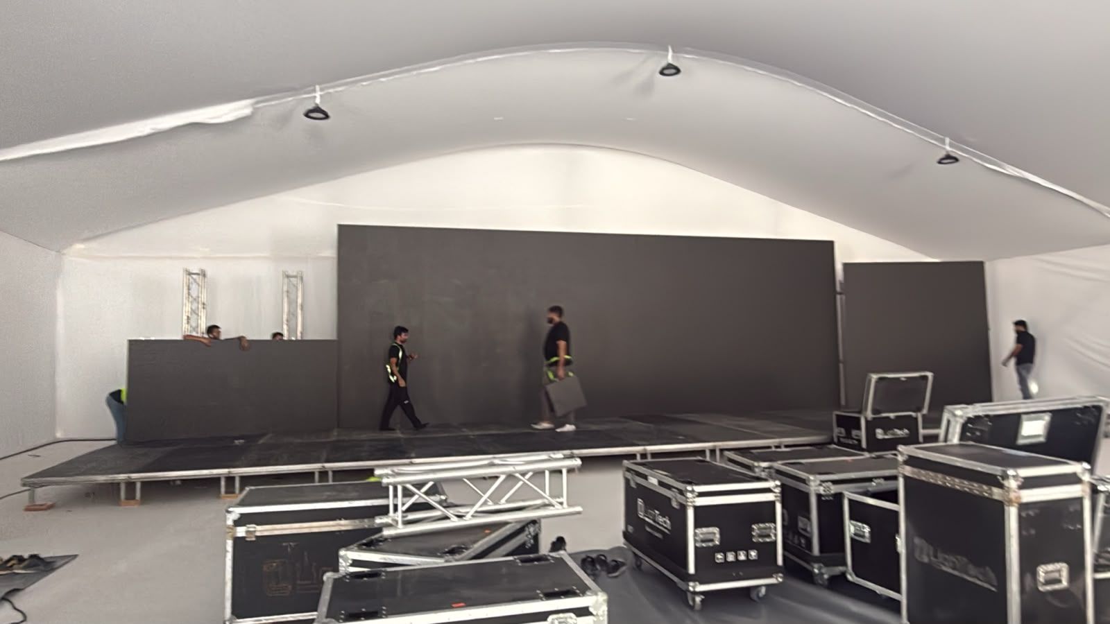 LED wall panels being installed on the stage inside the Weston by Wadan groundbreaking ceremony marquee